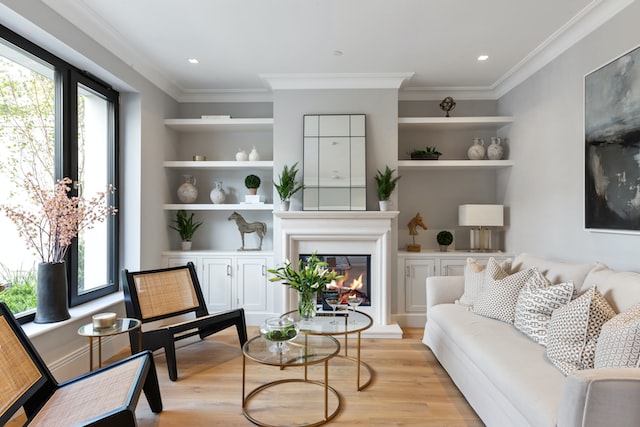 living room with white couch, built in bookshelves and large picture window